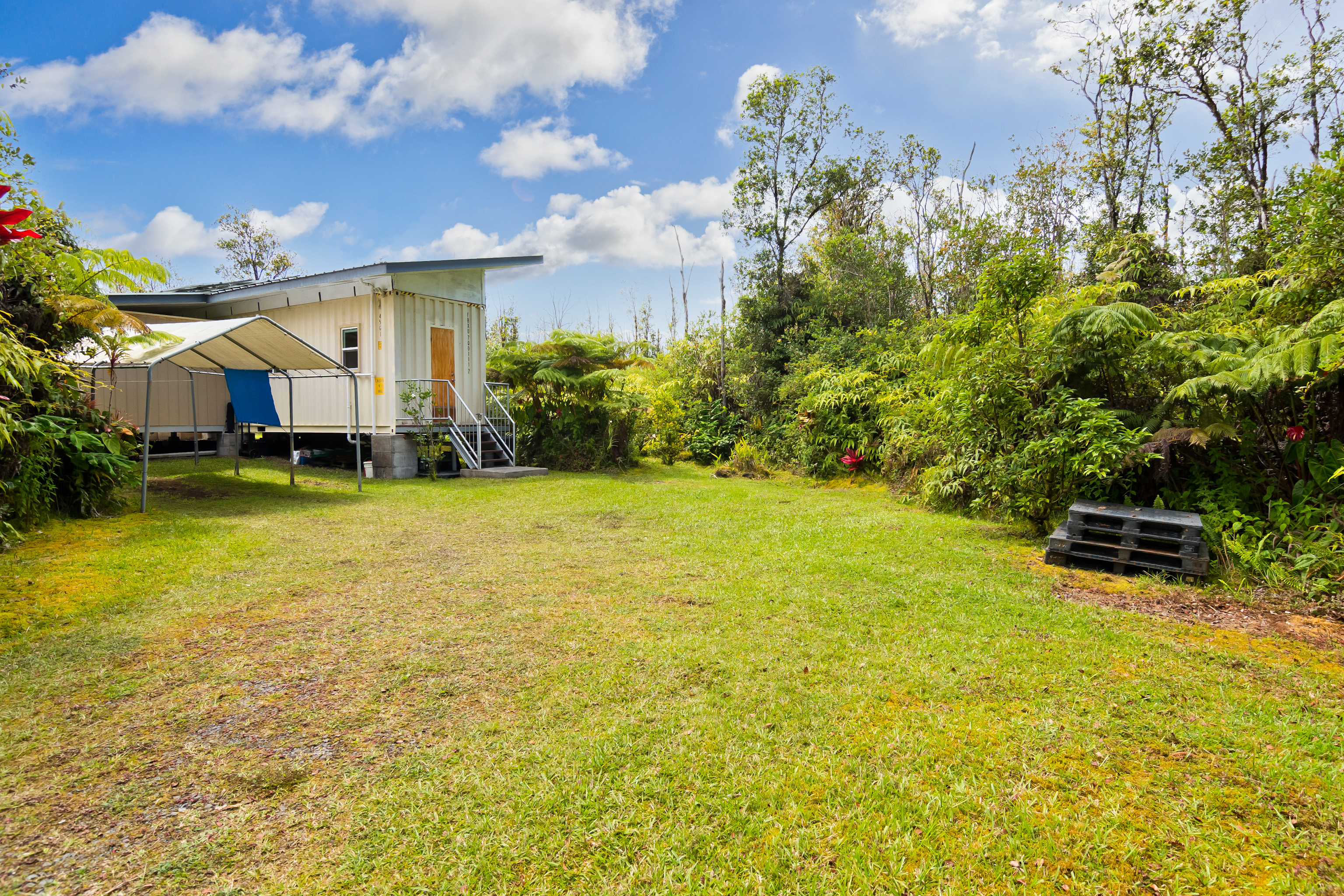 11-2430 Makoa Road Mountain View, HI 96771 - Photo 22 of 30 a view of a house with a yard