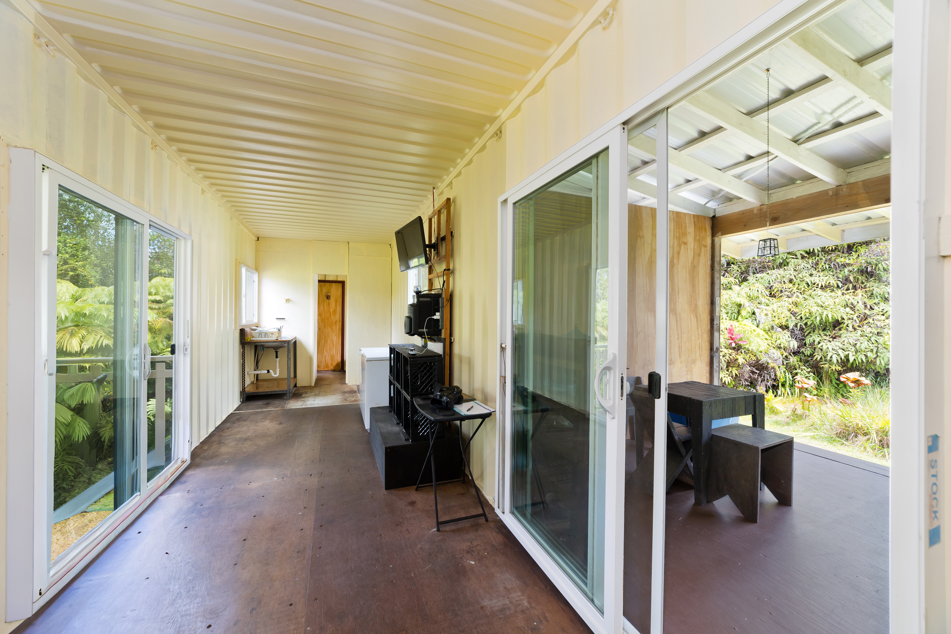 11-2430 Makoa Road Mountain View, HI 96771 - Photo 8 of 30 a view of hallway with furniture and a large window