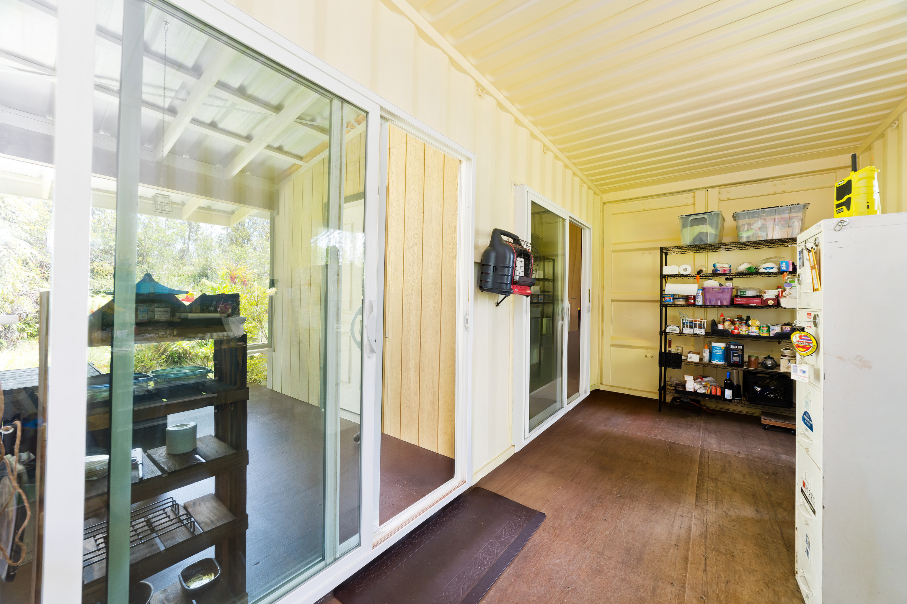 11-2430 Makoa Road Mountain View, HI 96771 - Photo 9 of 30 a view of a livingroom with furniture and a window