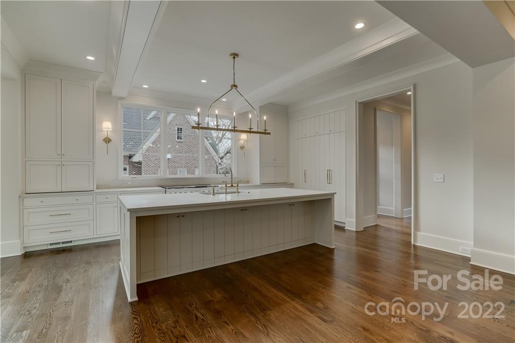 1429 Audubon Road Charlotte, NC 28211 - Photo 14 of 48 a view of room with wooden floor and staircase