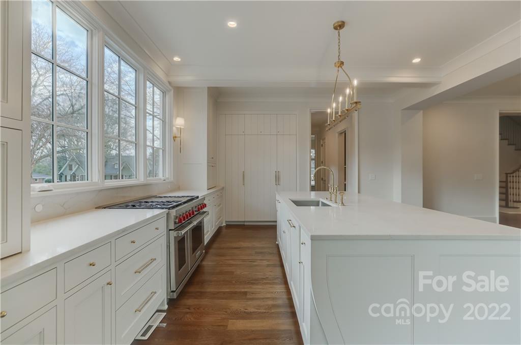 1429 Audubon Road Charlotte, NC 28211 - Photo 16 of 48 a large white kitchen with a large window