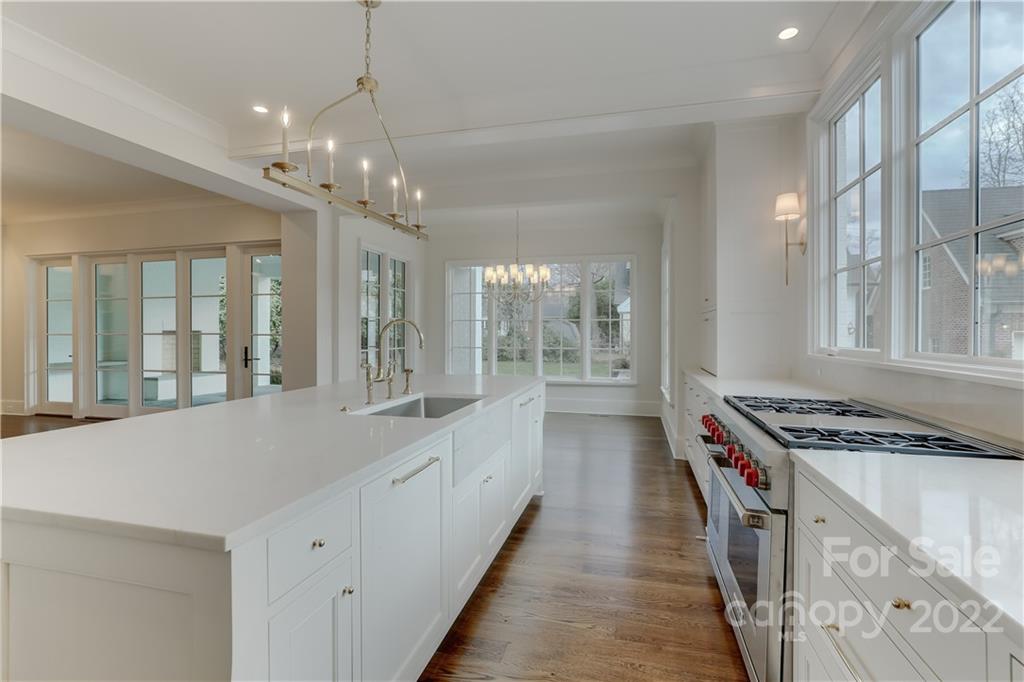 1429 Audubon Road Charlotte, NC 28211 - Photo 17 of 48 a kitchen with stainless steel appliances granite countertop a stove and a sink