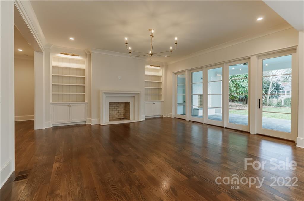 1429 Audubon Road Charlotte, NC 28211 - Photo 20 of 48 an empty room with wooden floor and windows