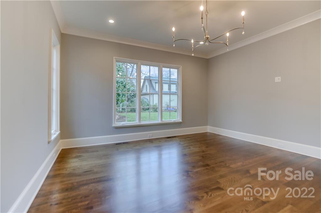 1429 Audubon Road Charlotte, NC 28211 - Photo 23 of 48 an empty room with wooden floor and windows