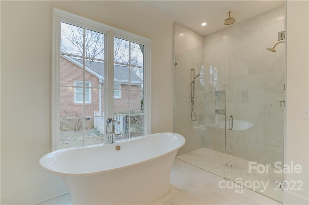 1429 Audubon Road Charlotte, NC 28211 - Photo 25 of 48 a bathroom with a sink shower and a mirror