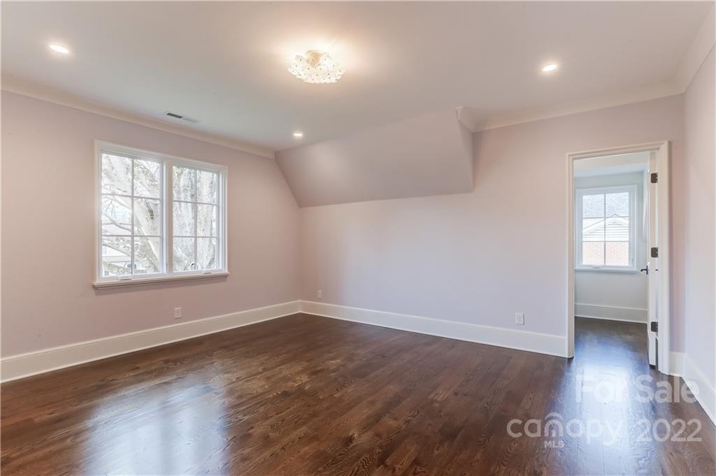 1429 Audubon Road Charlotte, NC 28211 - Photo 30 of 48 an empty room with wooden floor and windows