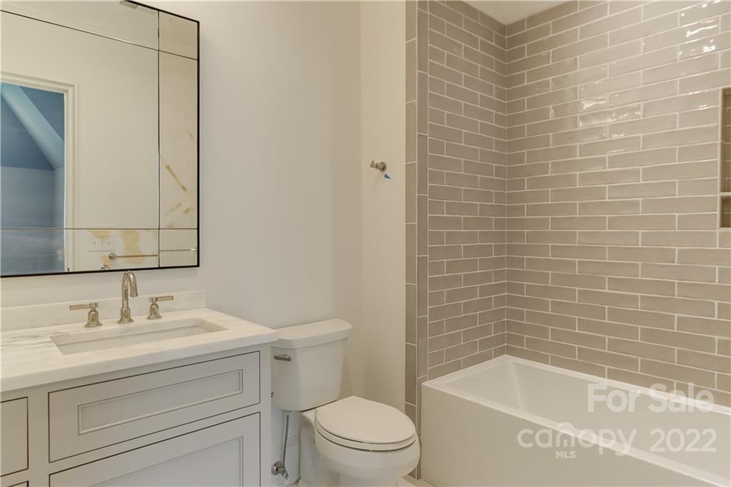 1429 Audubon Road Charlotte, NC 28211 - Photo 33 of 48 a bathroom with a sink a toilet and shower