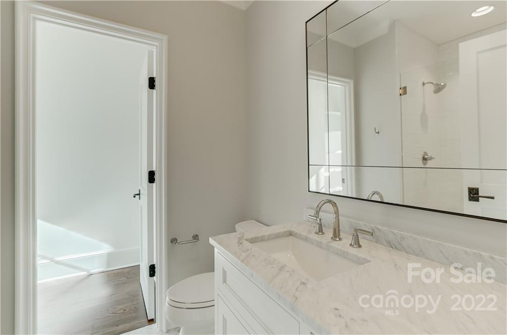 1429 Audubon Road Charlotte, NC 28211 - Photo 35 of 48 a bathroom with a granite countertop sink toilet and shower