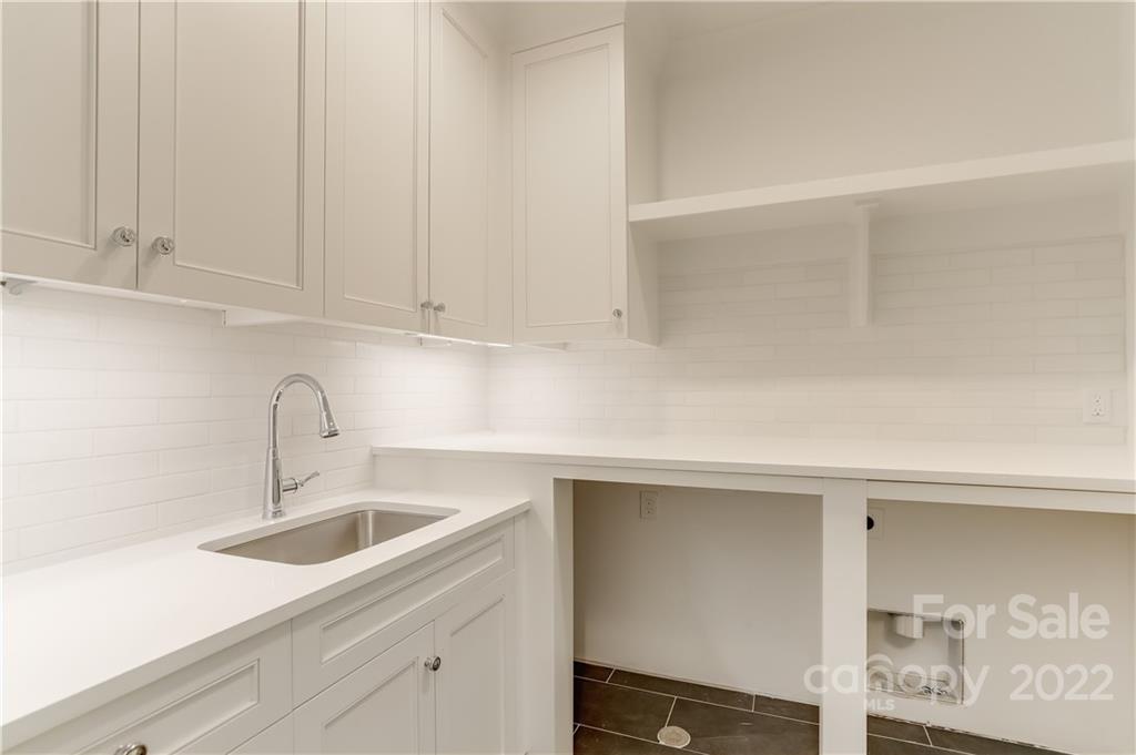 1429 Audubon Road Charlotte, NC 28211 - Photo 39 of 48 a kitchen with a sink and cabinets