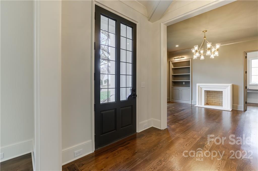 1429 Audubon Road Charlotte, NC 28211 - Photo 4 of 48 wooden floor in an empty room with a window