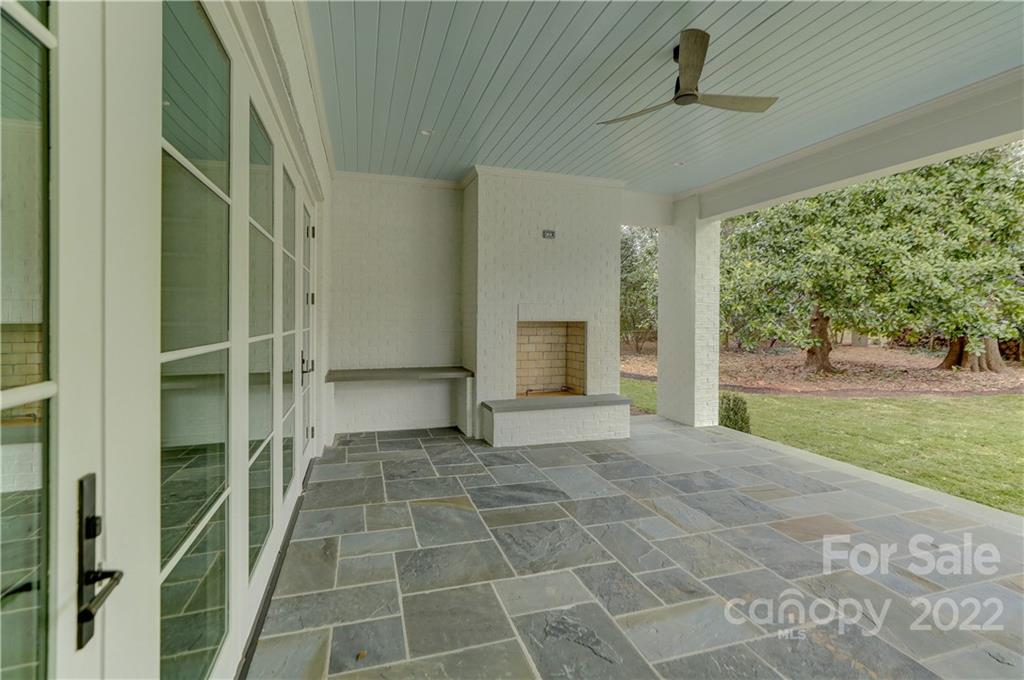 1429 Audubon Road Charlotte, NC 28211 - Photo 46 of 48 a view of an empty room with a fireplace and a yard
