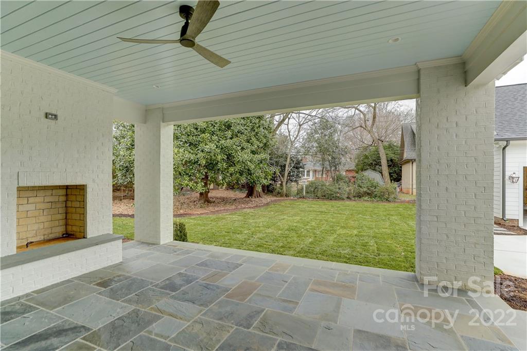 1429 Audubon Road Charlotte, NC 28211 - Photo 47 of 48 a view of a porch with a table and chairs in front of a house