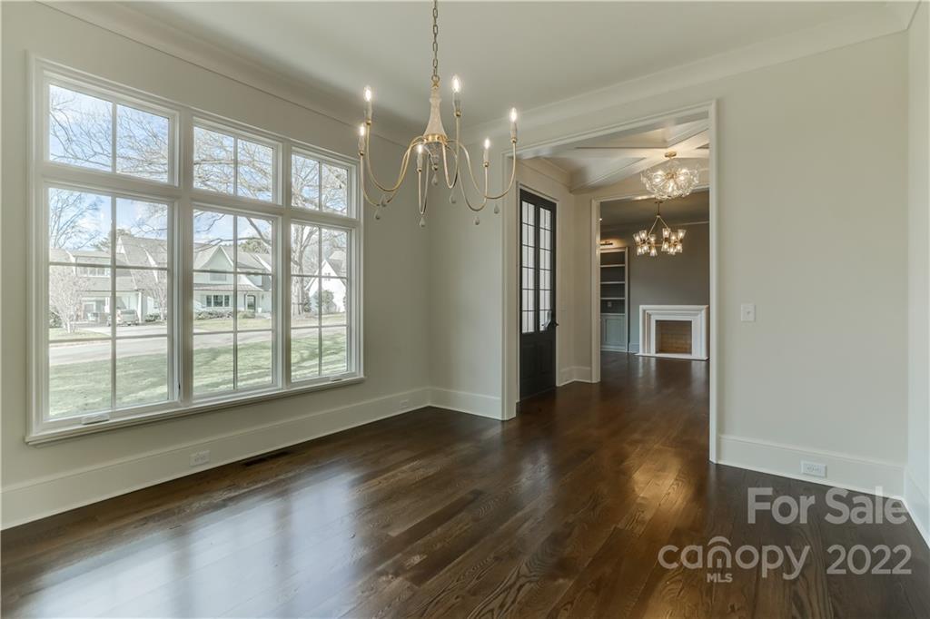 1429 Audubon Road Charlotte, NC 28211 - Photo 9 of 48 an empty room with wooden floor and windows