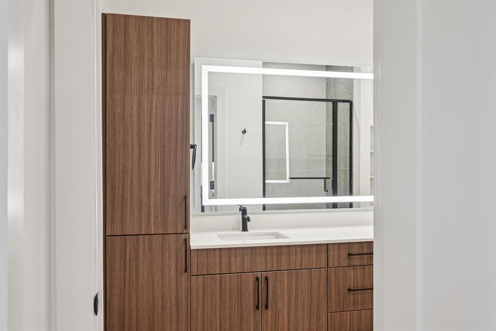 2016 South Ervay Street, Unit A1 Dallas, TX 75215 - Photo 15 of 35 Bathroom featuring vanity and a shower stall