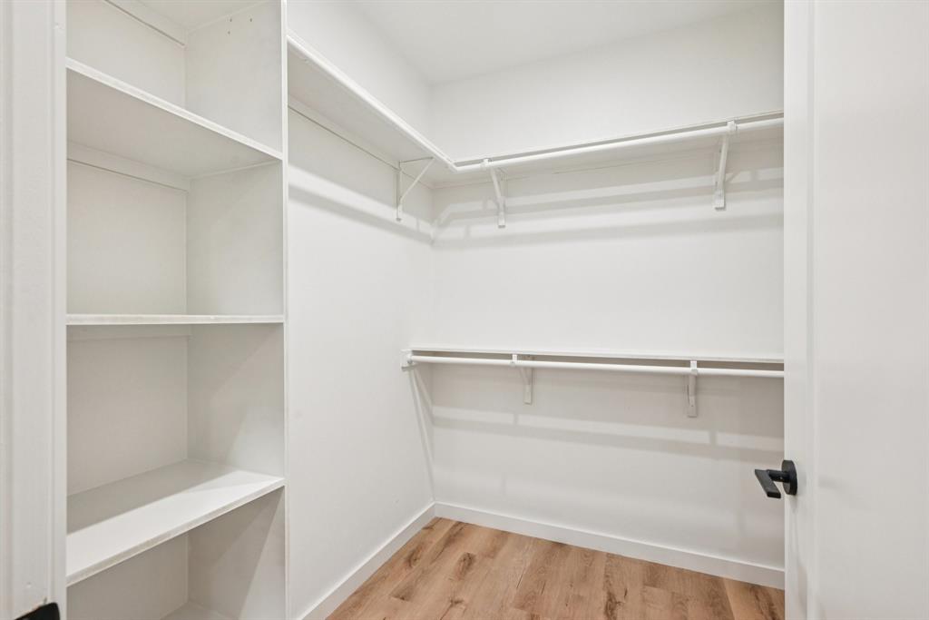 2016 South Ervay Street, Unit A1 Dallas, TX 75215 - Photo 20 of 35 Walk in closet featuring light wood-type flooring