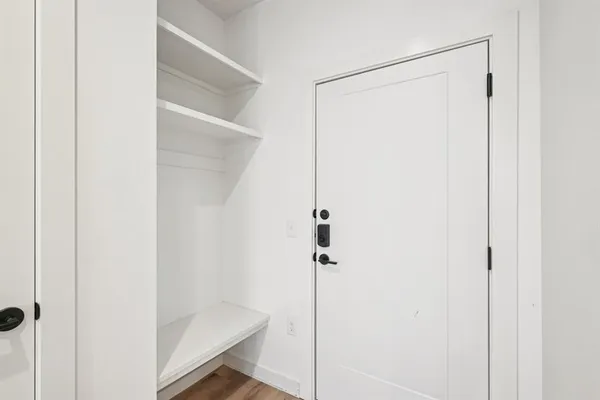 a bathroom with a glass shower door