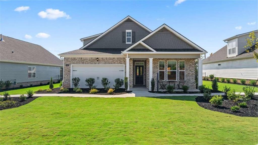 652 Parnassus Road Locust Grove, GA 30248 - Photo 2 of 43 a front view of a house with swimming pool and porch with furniture