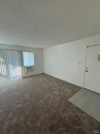 a view of a balcony with wooden floor