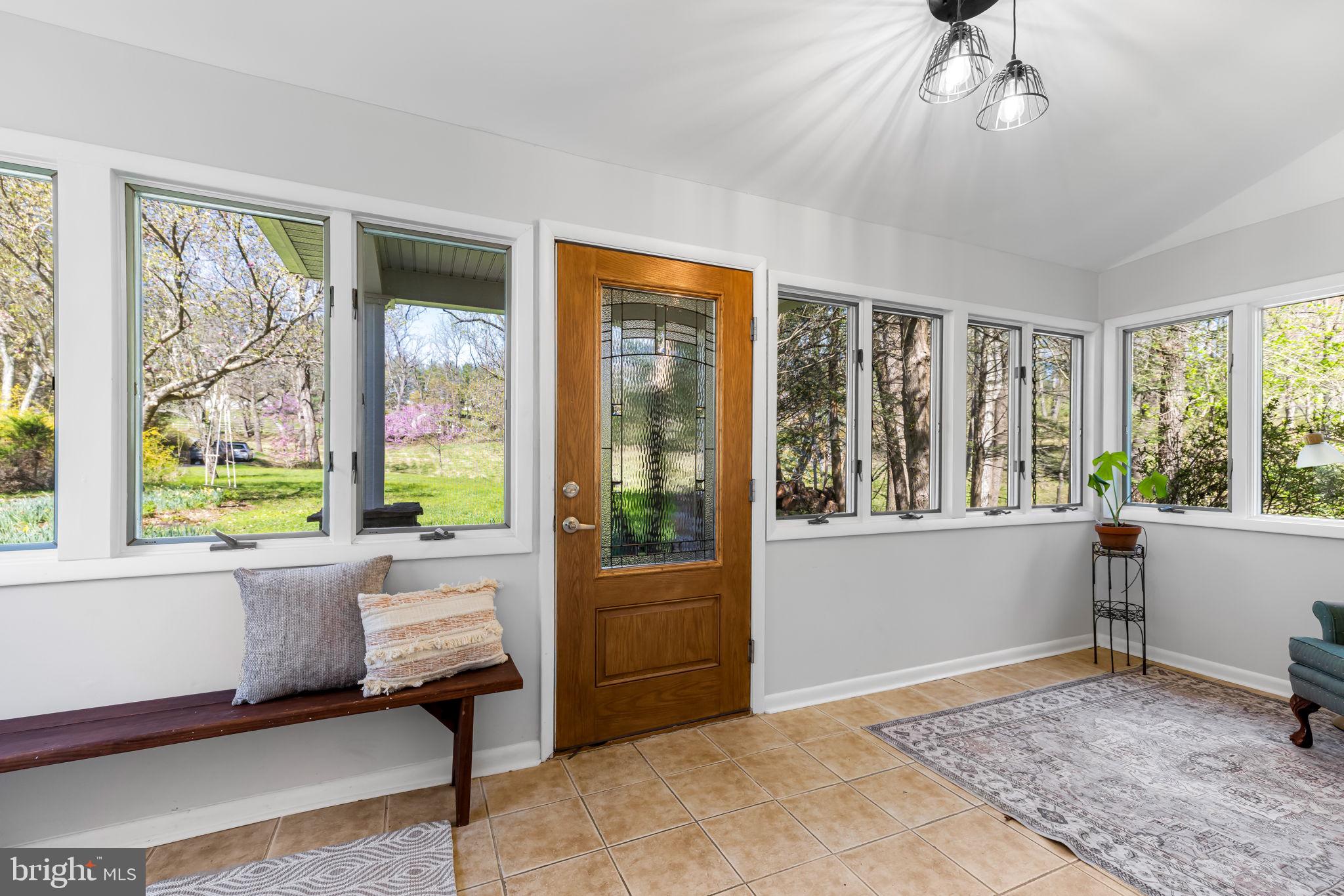 8230 Dogwood Road Windsor Mill, MD 21244 - Photo 4 of 58 Sunroom at the front of the house