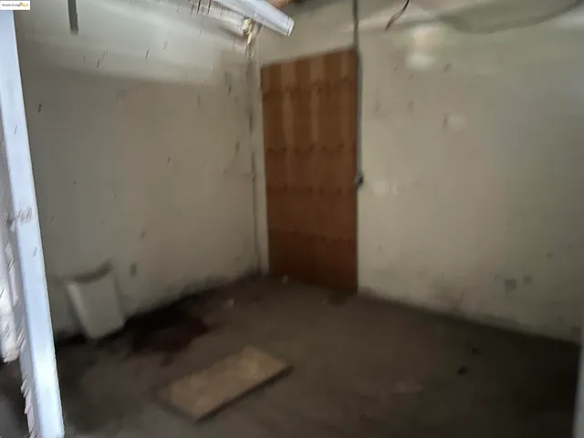 a view of a utility room with a door