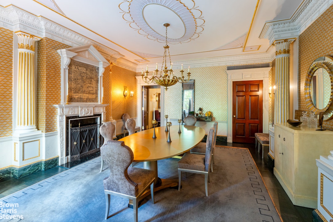 109 East 69th Street Manhattan, NY 10021 - Photo 9 of 12 a dining room with furniture a chandelier and wooden floor