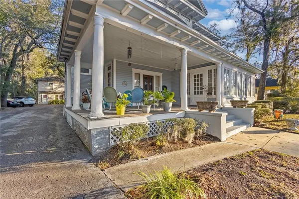 a view of a building with a bench in a patio
