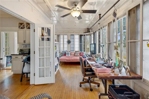 a view of a livingroom with furniture and a window