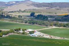 6500 Santa Rosa Road Buellton, CA 93427 - Photo 4 of 97 a view of a lake with a yard