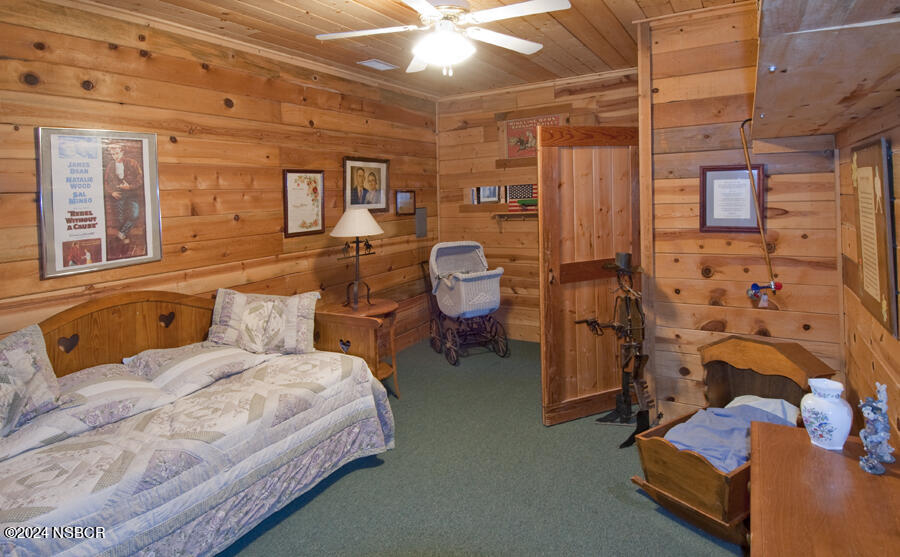 6500 Santa Rosa Road Buellton, CA 93427 - Photo 47 of 97 a bedroom with bed and wooden floor