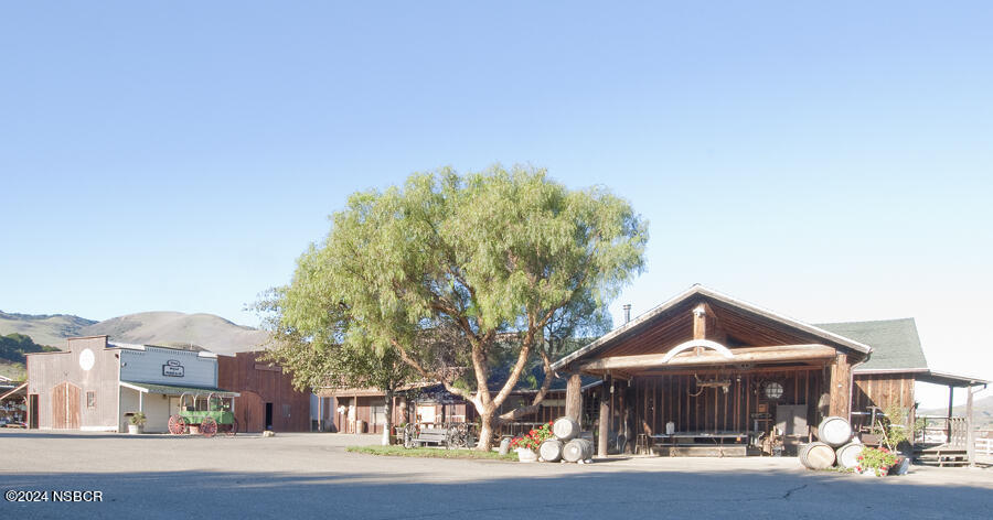 6500 Santa Rosa Road Buellton, CA 93427 - Photo 54 of 97 a front view of house with yard outdoor seating and covered with trees