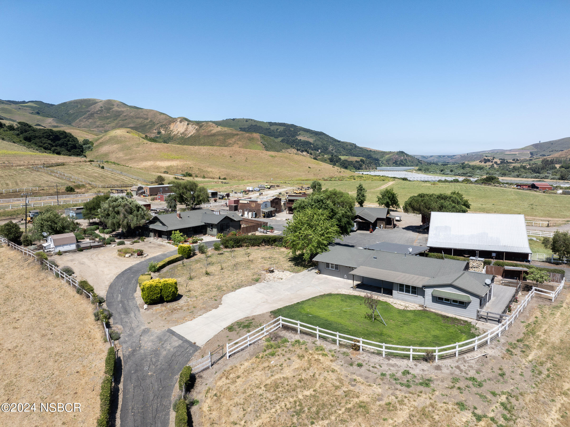 6500 Santa Rosa Road Buellton, CA 93427 - Photo 83 of 97 a view of a swimming pool with a table and chairs