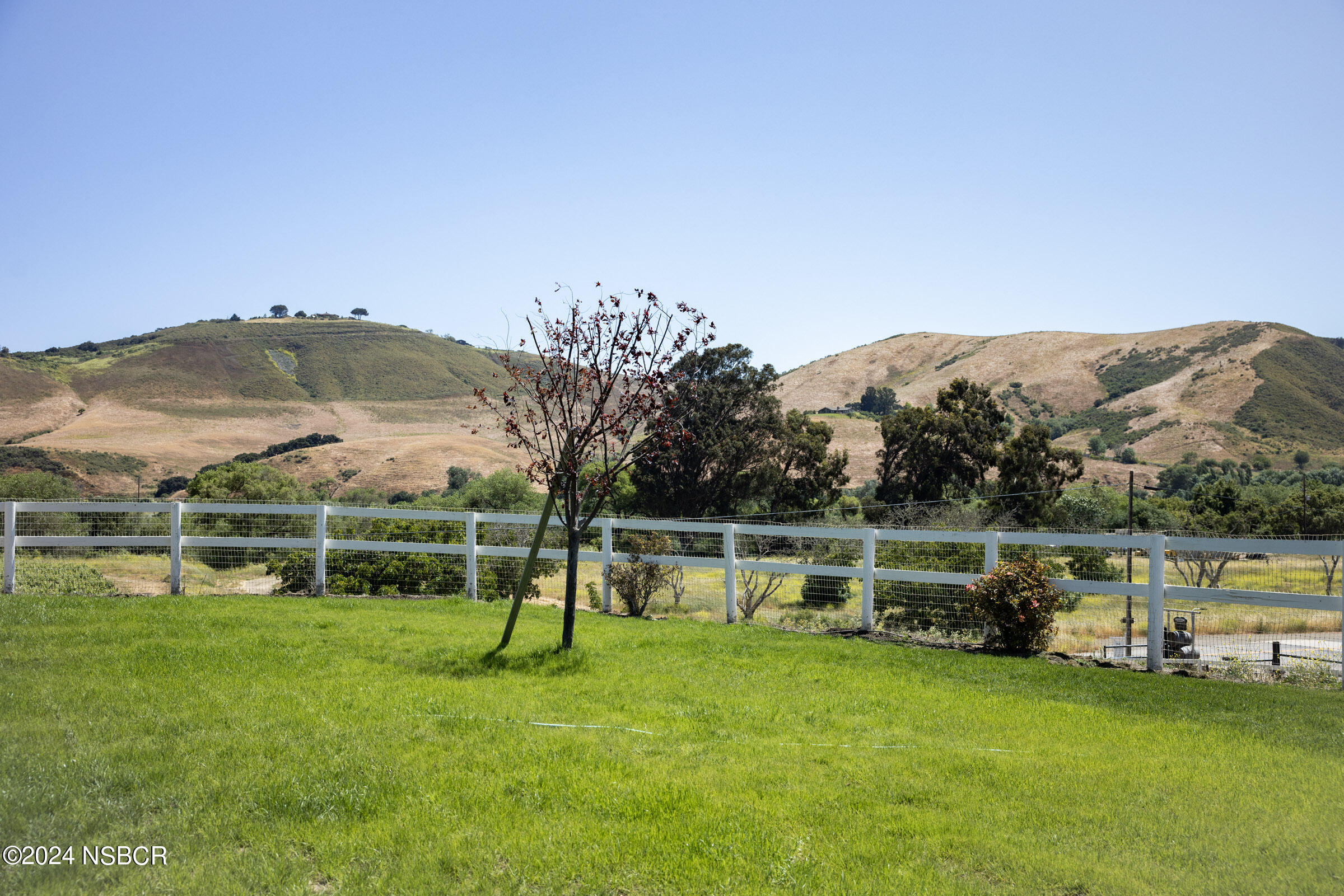 6500 Santa Rosa Road Buellton, CA 93427 - Photo 86 of 97 a view of a lake with a mountain in the background