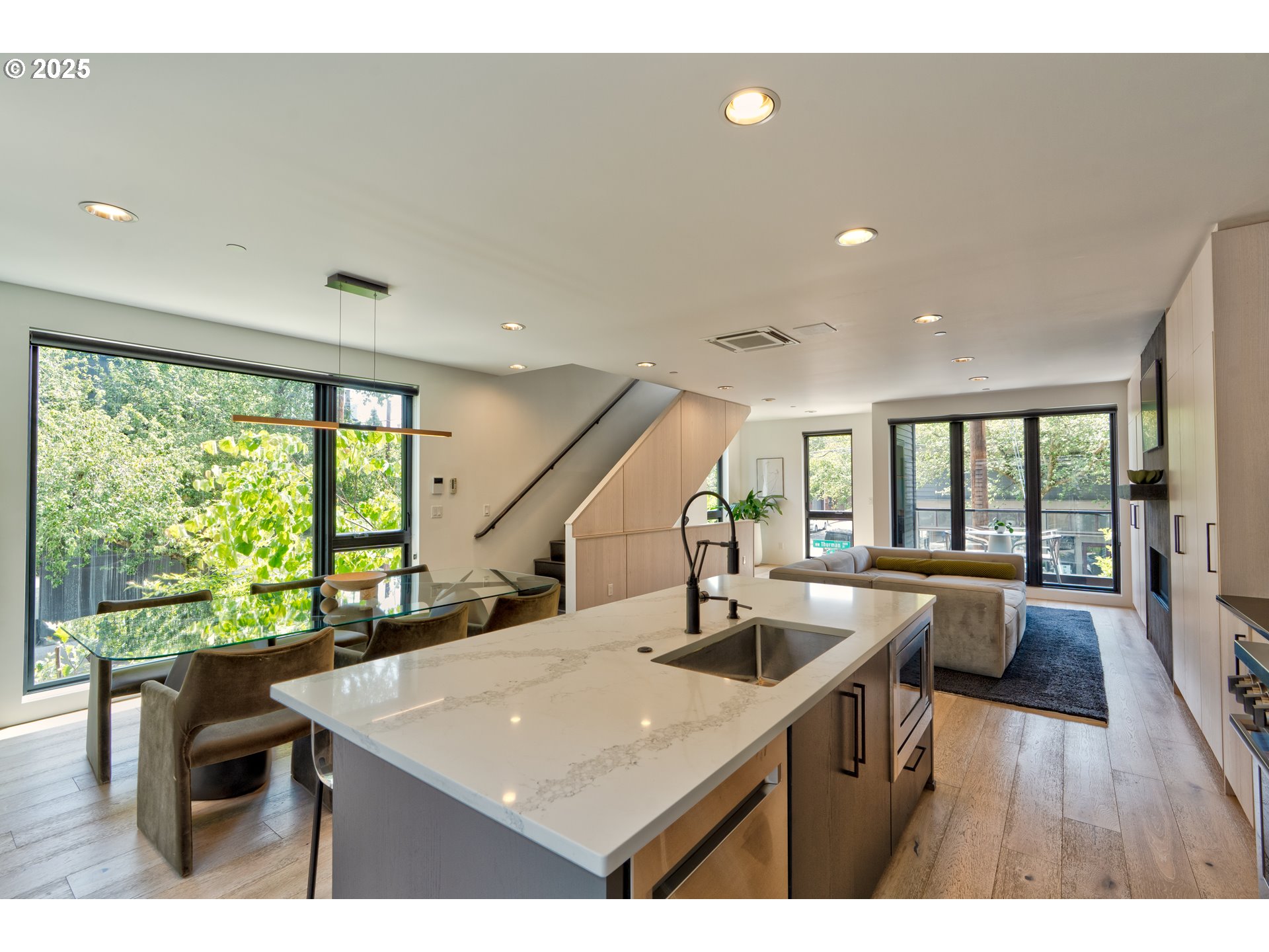 2805 Northwest Thurman Street Portland, OR 97210 - Photo 14 of 42 a kitchen with a table chairs and wooden floor