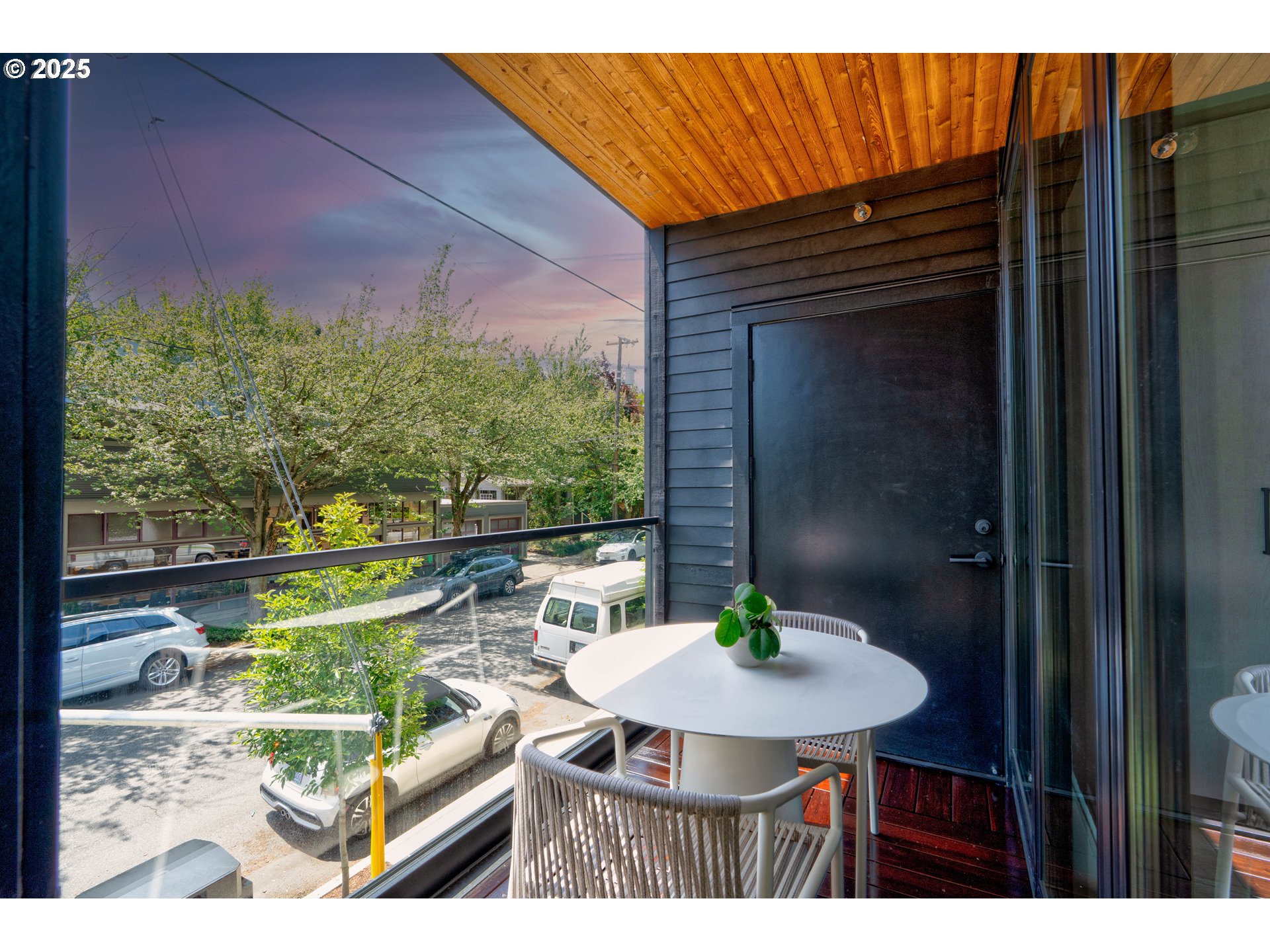2805 Northwest Thurman Street Portland, OR 97210 - Photo 18 of 42 a balcony with table and chairs