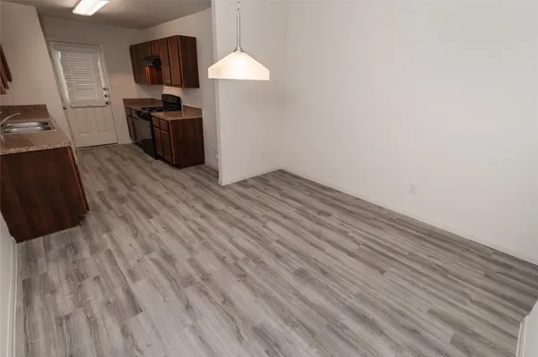 a view of a kitchen from the hallway