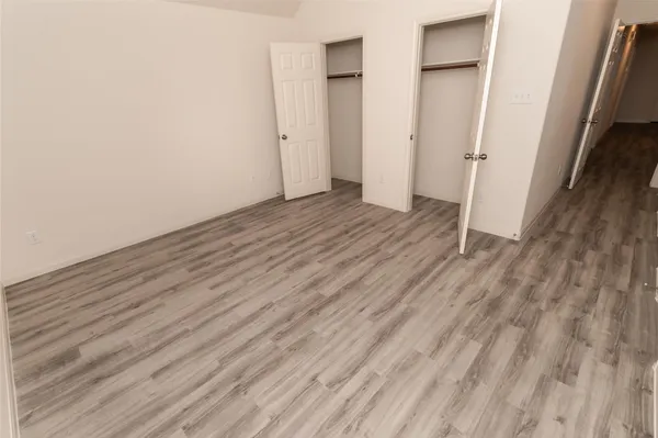a view of a room with wooden floor and staircase