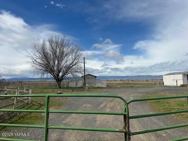 3140 Barkes Road Harrah, WA 98933 - Photo 2 of 3 a view of a yard in front of a house