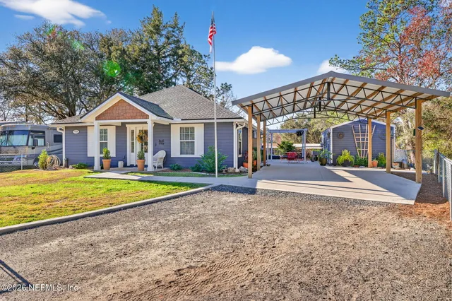 a house with swimming pool in front of it