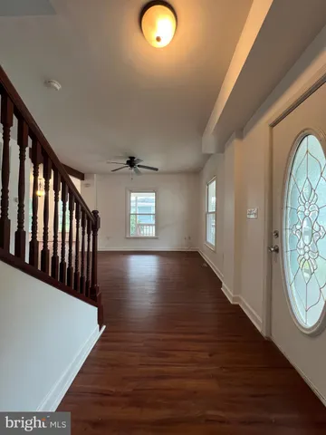 a view of entryway with wooden floor