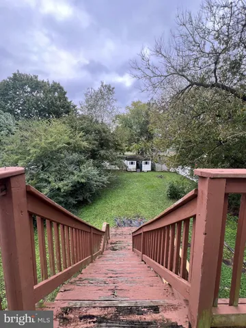 a view of a deck with a yard