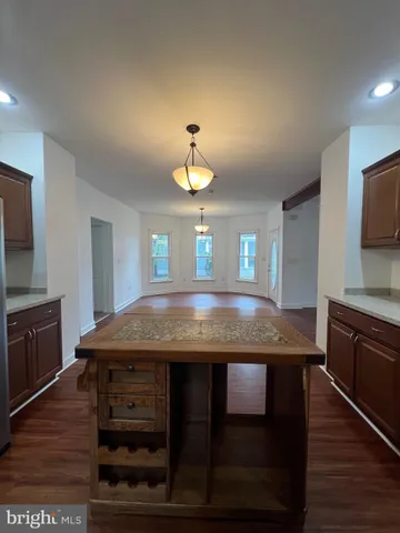 a kitchen with a stove a sink and a refrigerator
