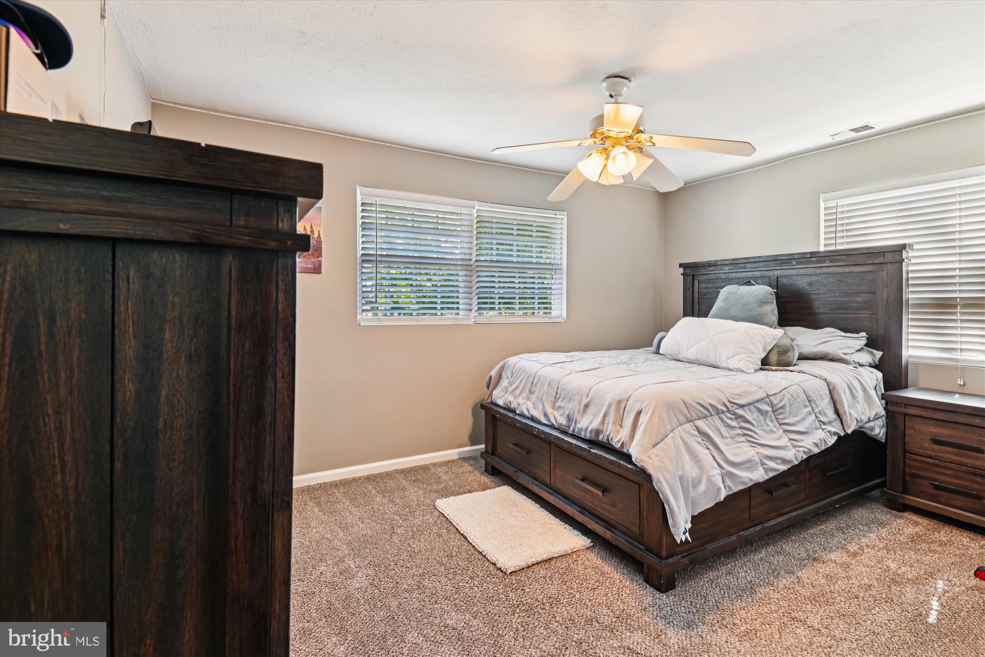 851 Annapolis Avenue Edgewater, MD 21037 - Photo 20 of 52 a spacious bedroom with a bed and a window