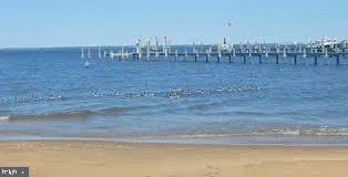 an aerial view of a house with outdoor space lake view and lake view