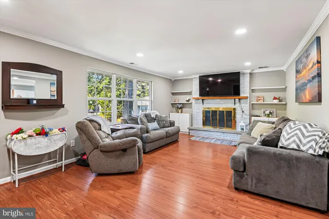 a living room with furniture window and flat screen tv