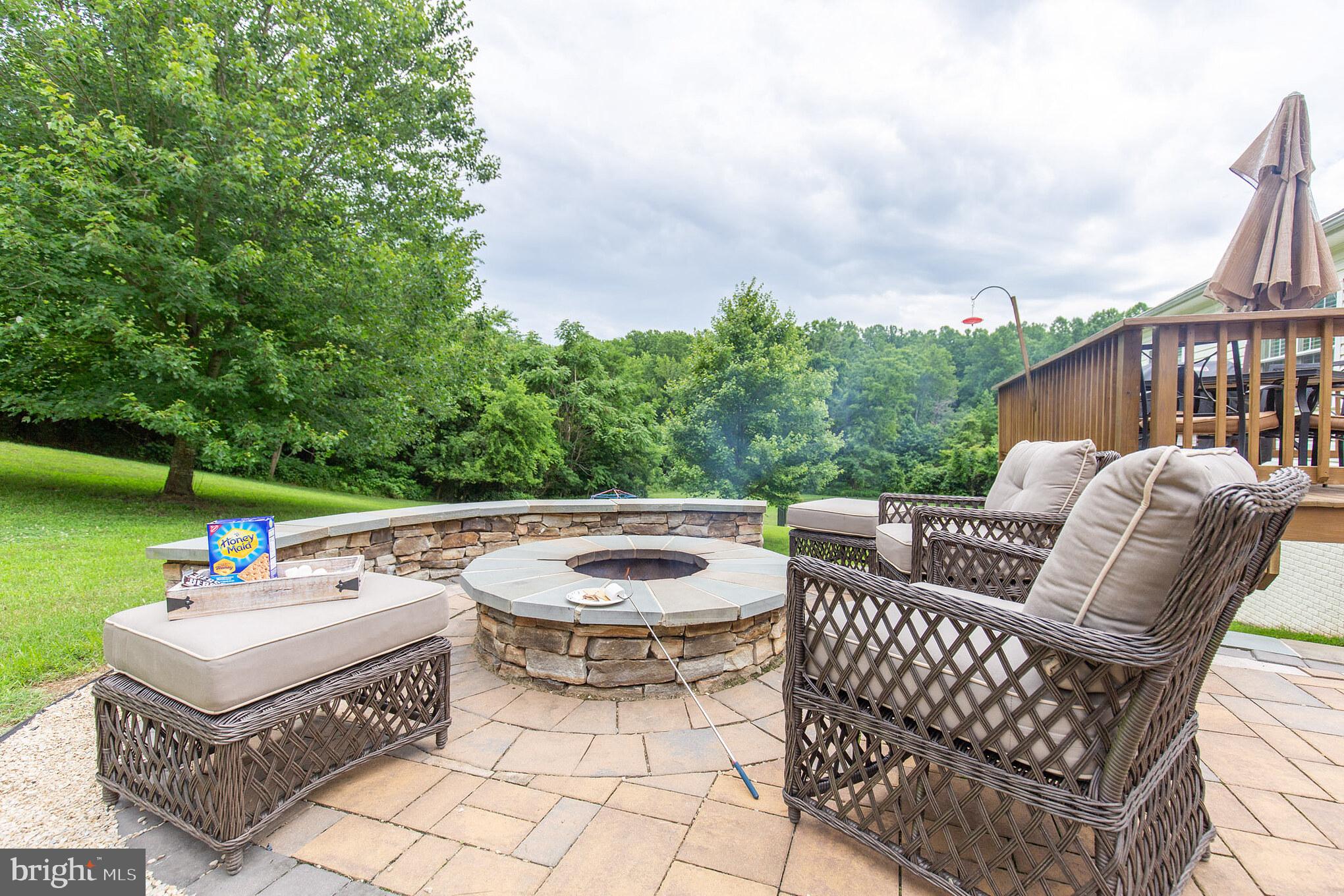 8965 Lightning Lane Owings, MD 20736 - Photo 4 of 45 Paver Patio with Fire Pit