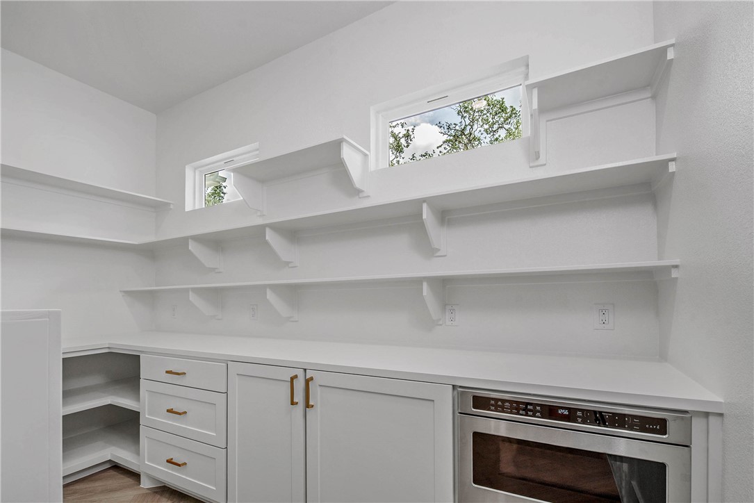 2201 High Meadows Trail Franklin, TX 77856 - Photo 25 of 50 a view of cabinets a washer and dryer in a room