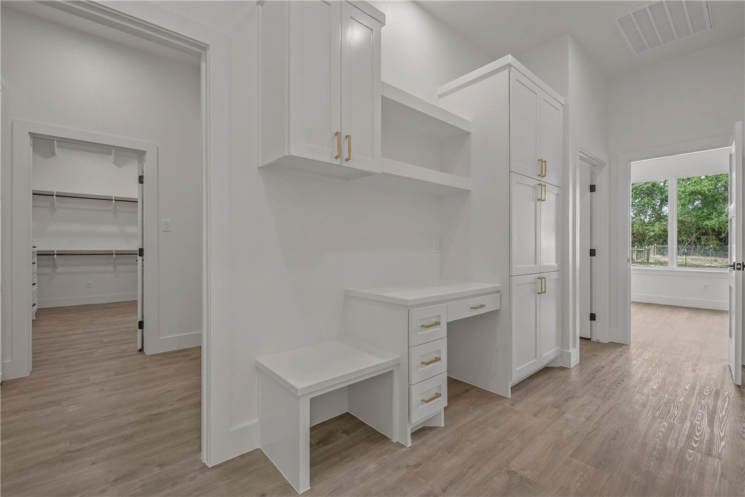 2201 High Meadows Trail Franklin, TX 77856 - Photo 26 of 50 a view of an empty room with wooden floor and a window