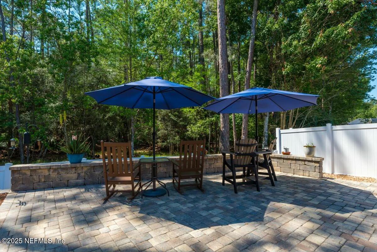 4329 Comanche Trail Boulevard St. Johns, FL 32259 - Photo 54 of 78 a view of backyard with seating space and trees