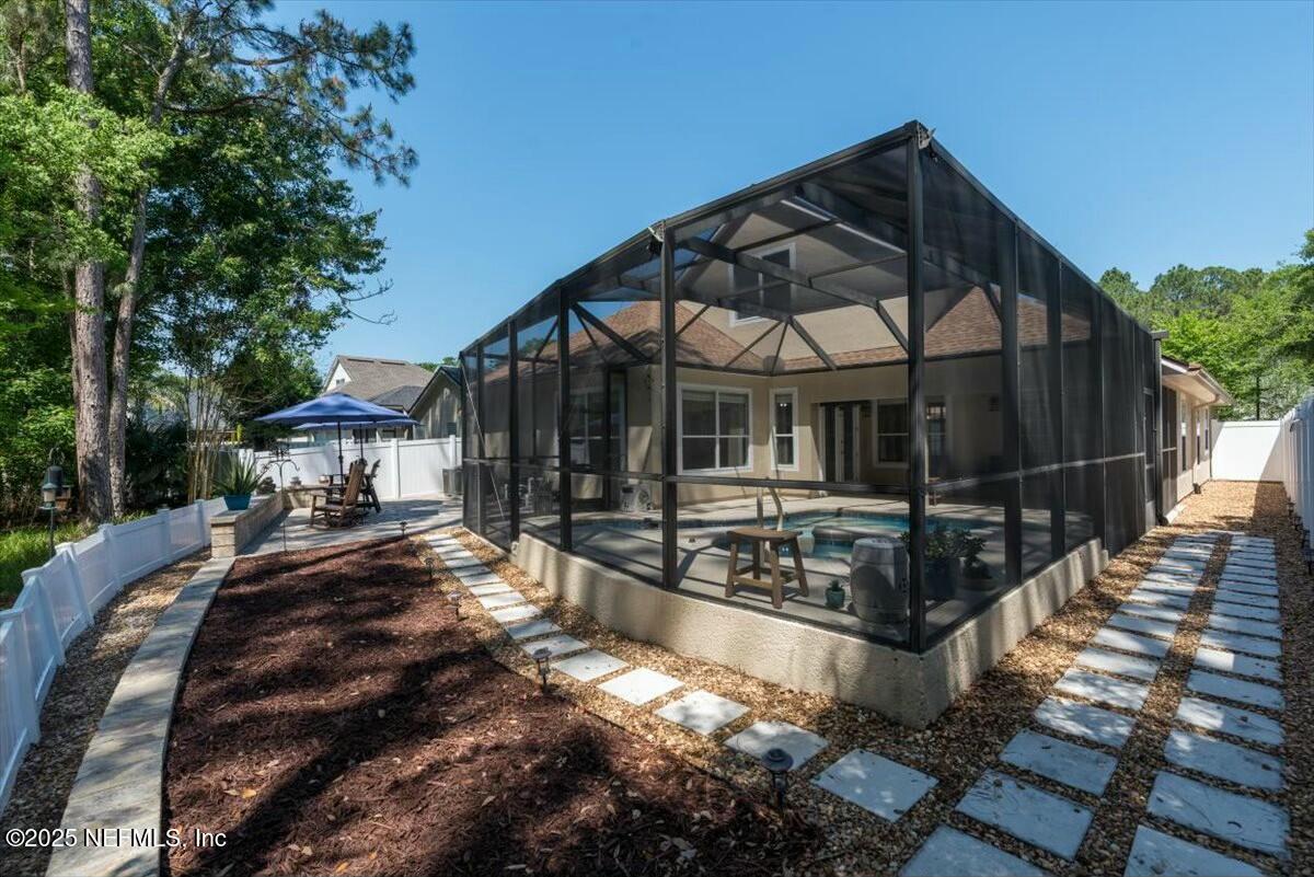 4329 Comanche Trail Boulevard St. Johns, FL 32259 - Photo 59 of 78 a view of a house with backyard and sitting area