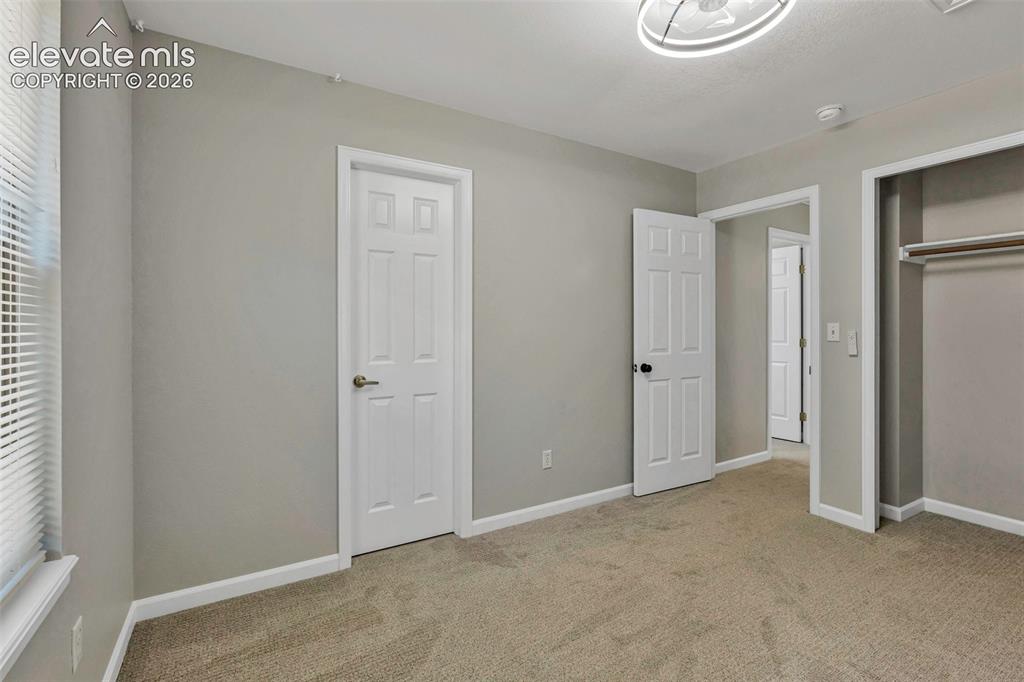 17370 Sweet Road Peyton, CO 80831 - Photo 33 of 38 Nice sized bedroom #2 with bathroom access.